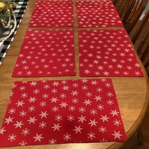 Six red with white snowflakes placemats